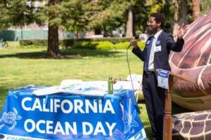 Environment California Conservation Associate Ben Grundy addresses crowd at California Ocean Day